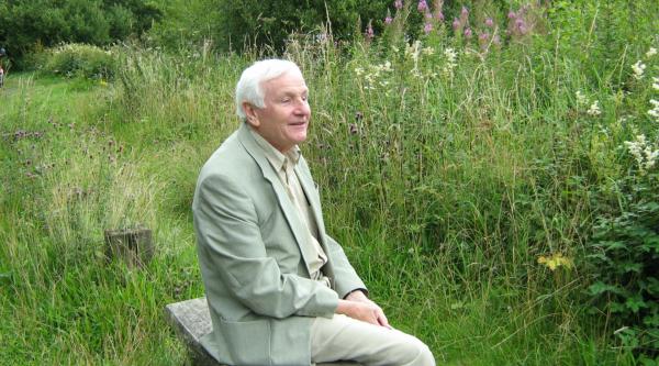 Sylvie's Grandad Owl sitting on a bench