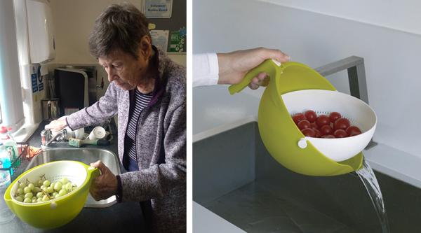 Woman stood by sink washing grapes and the Clever Colander being tilted over a sink 